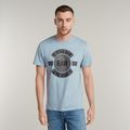 Badge Artwork T-Shirt - Light blue - Men