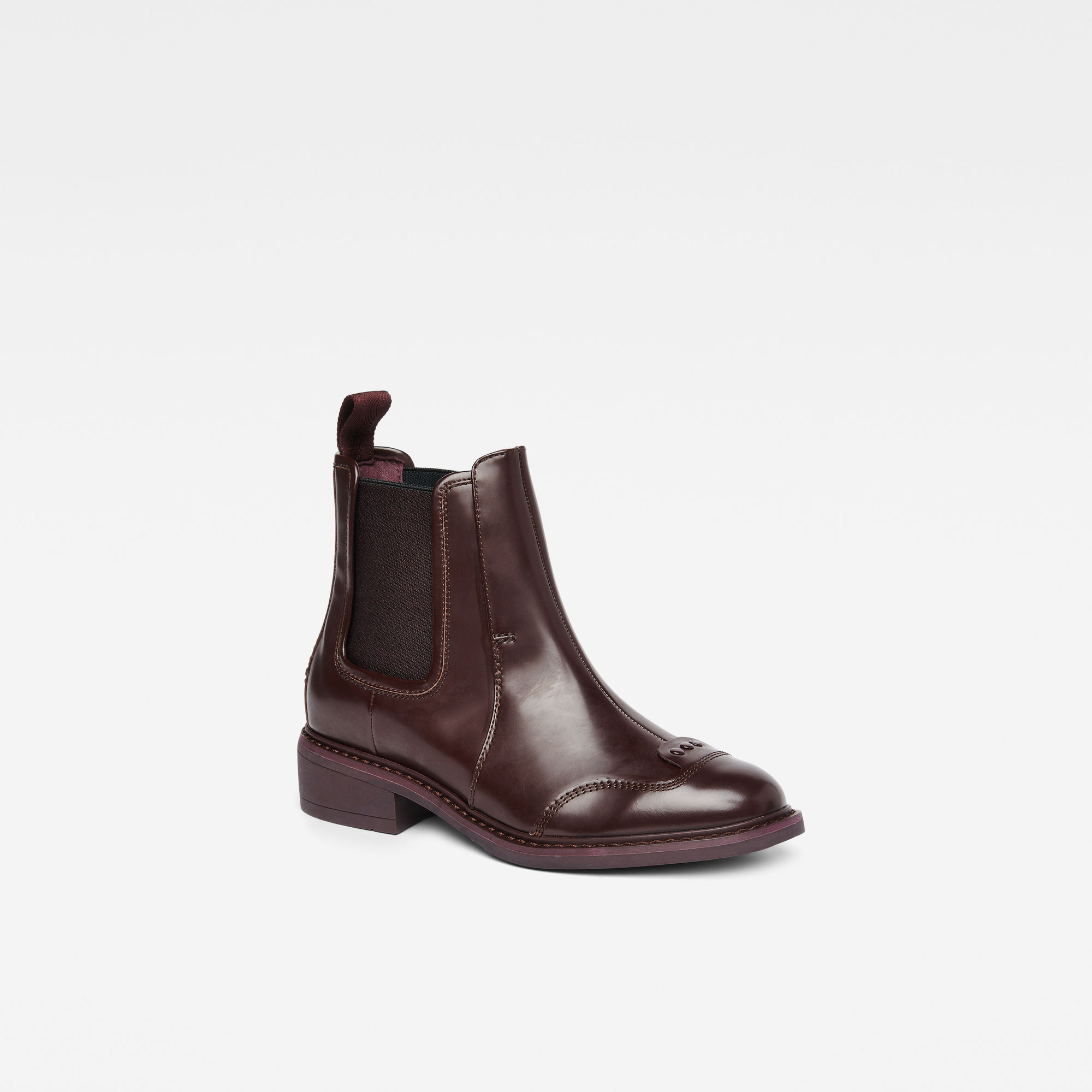 black chelsea boots brown sole