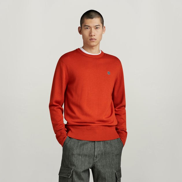 Orange knit sweater sales