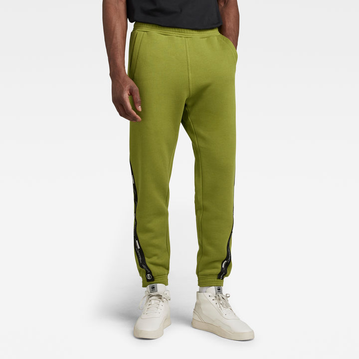 Green tape logo track pants clearance